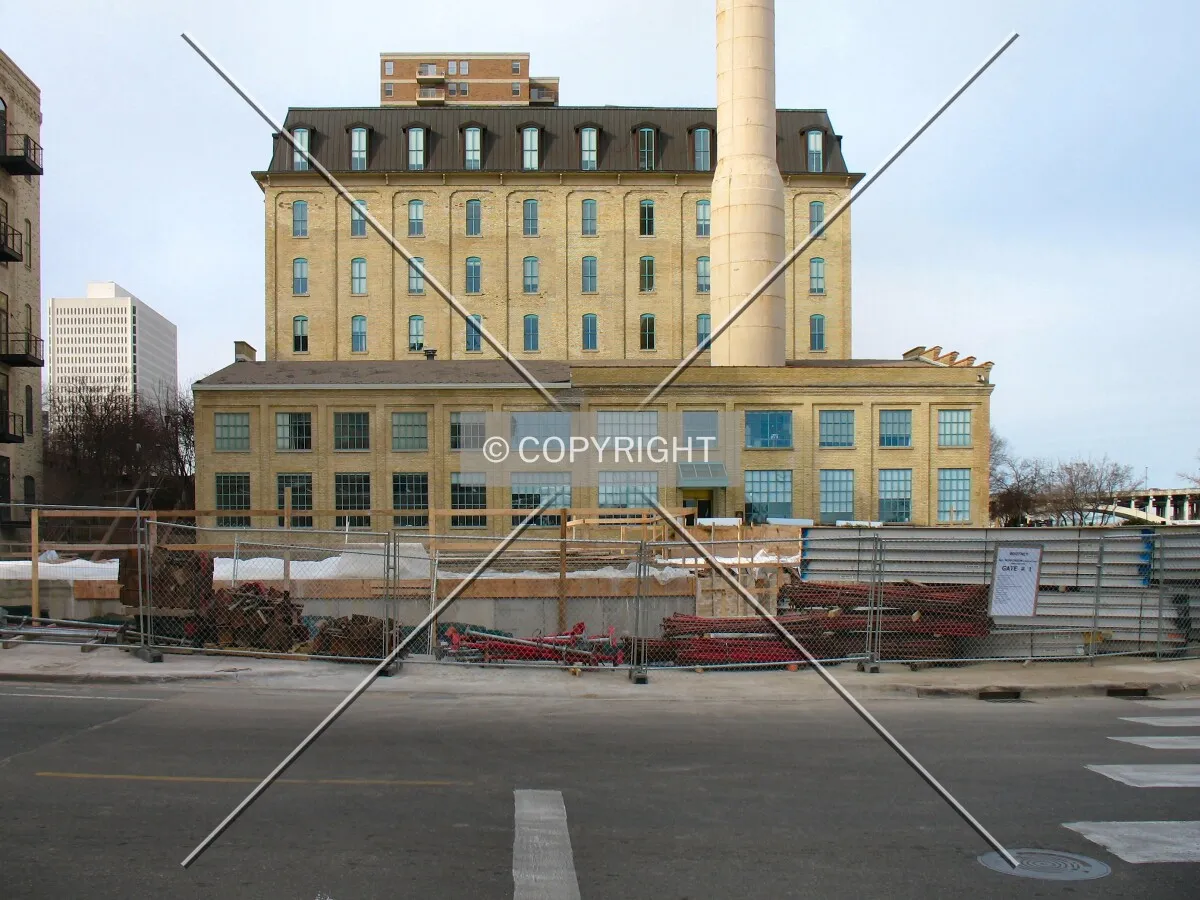View to the west across Portland Avenue, work on parking garage and plaza continues