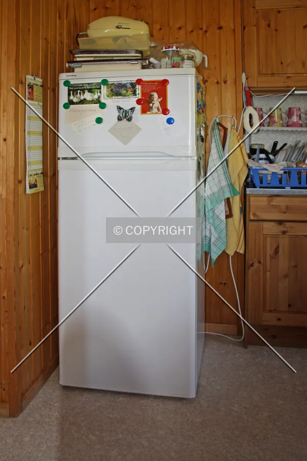 A white fridge in a kitchen