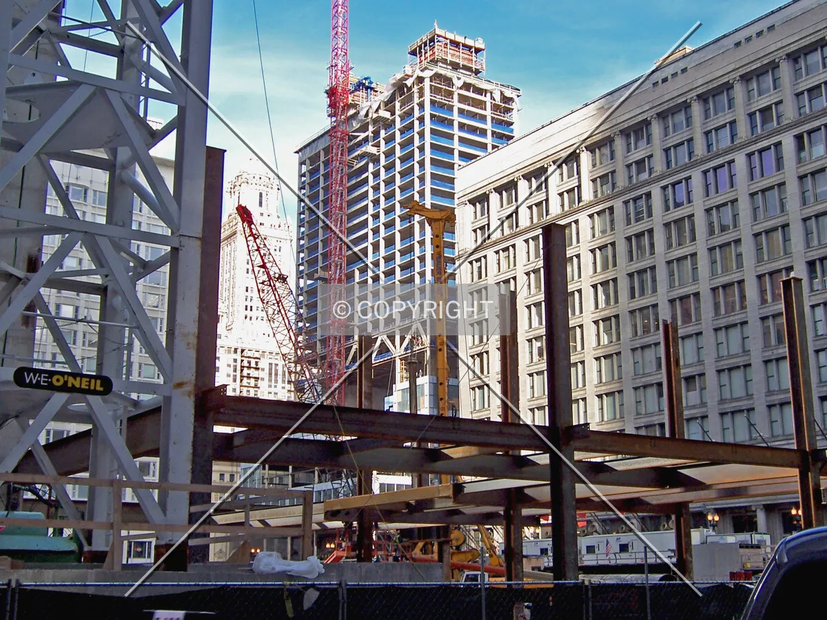 View from the southwest, with the office tower at 108 North State Street under construction in the foreground