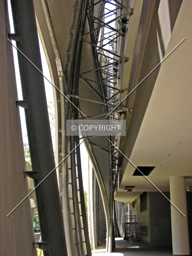 View of the interstitial space between car park and facade as seen from the west