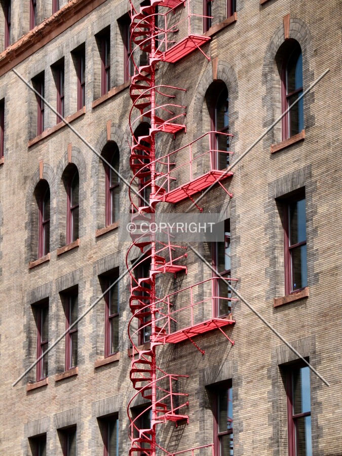 Spiral fire escape stairs along 1st Avenue North