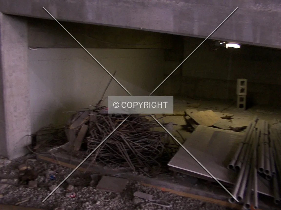 Under the parking ramp on the south side of the ground floor