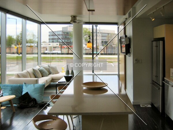View across main living space in model unit in Reflections Sales Office