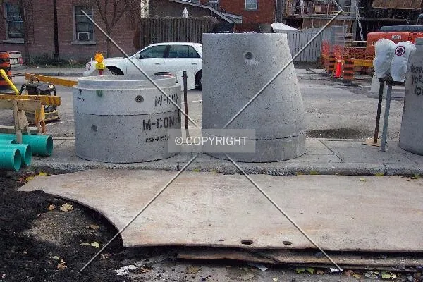 Concrete sewer connections to be installed below the building's foundation