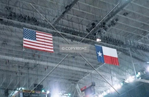 American and Texan flags hanging from the 125 foot high cieling