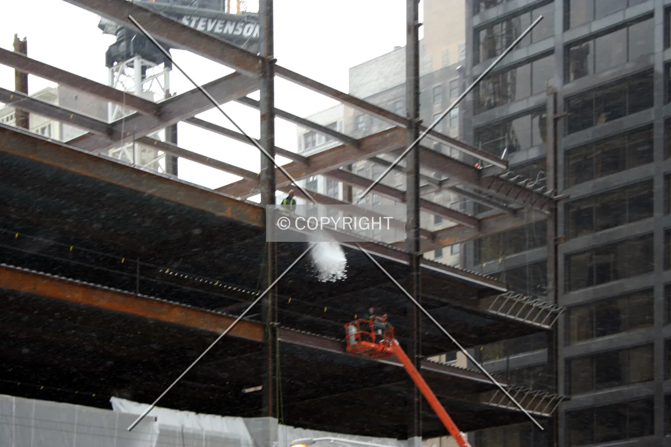 Shoveling snow off the 4th floor deck
