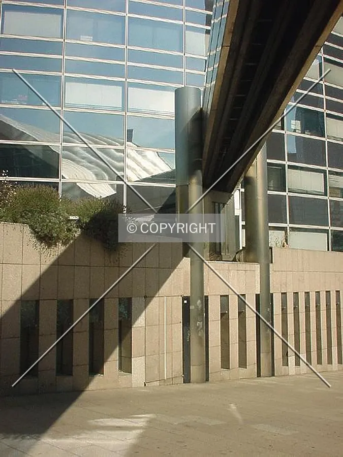 At the base of the tower; including a structural element of the CNIT building