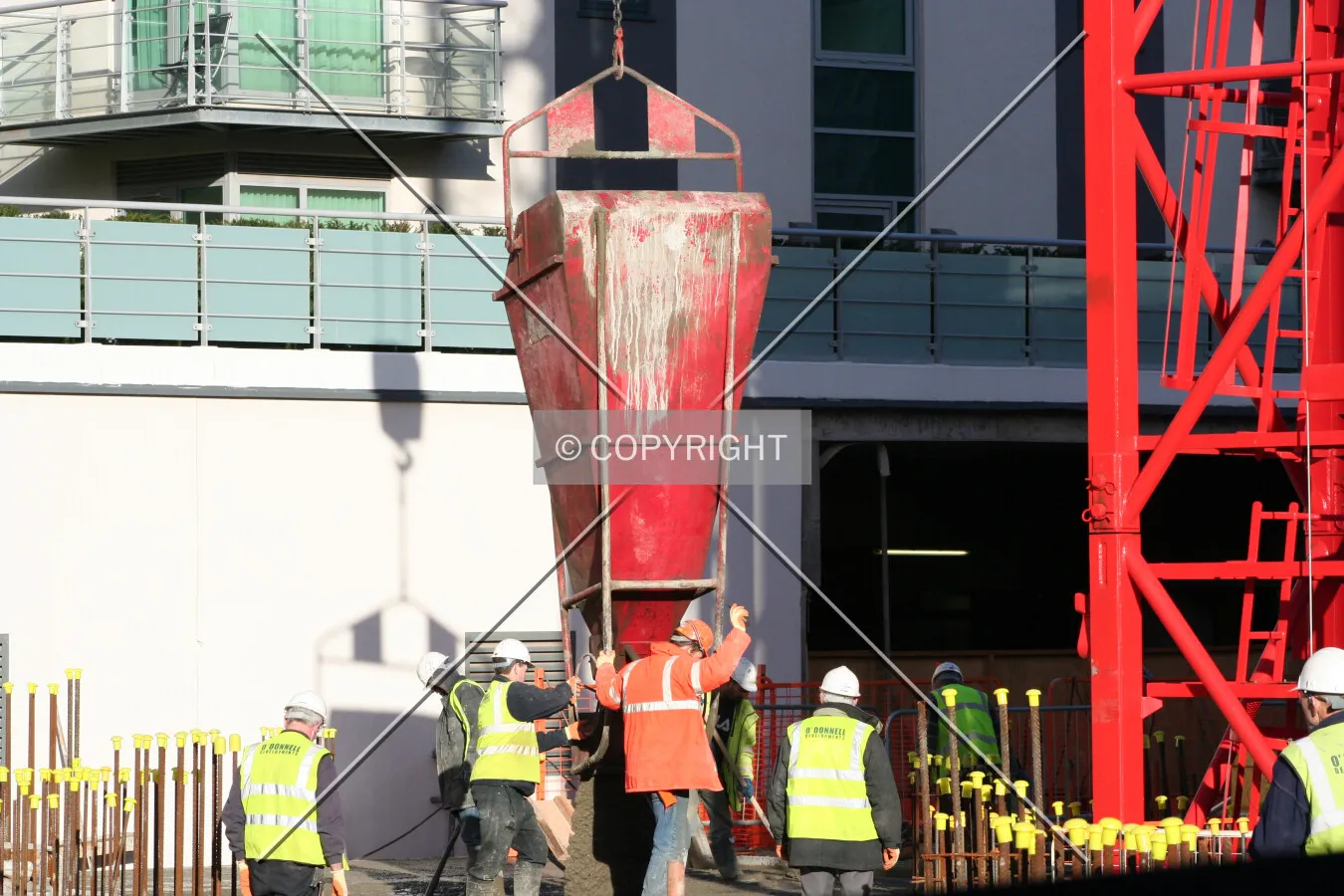 Construction workers laying cement