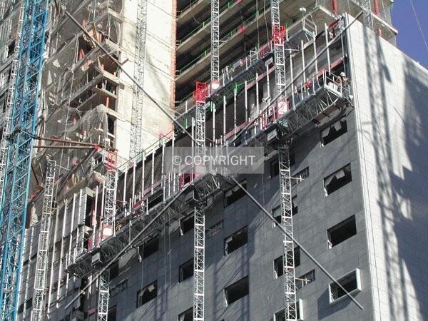 View of some elevators working on the facade