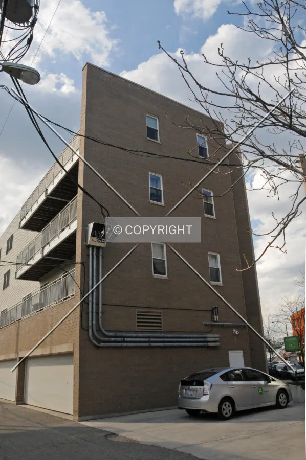 Southeast corner viewed from Winnebago Avenue at the mid-block alley. March 21, 2012.