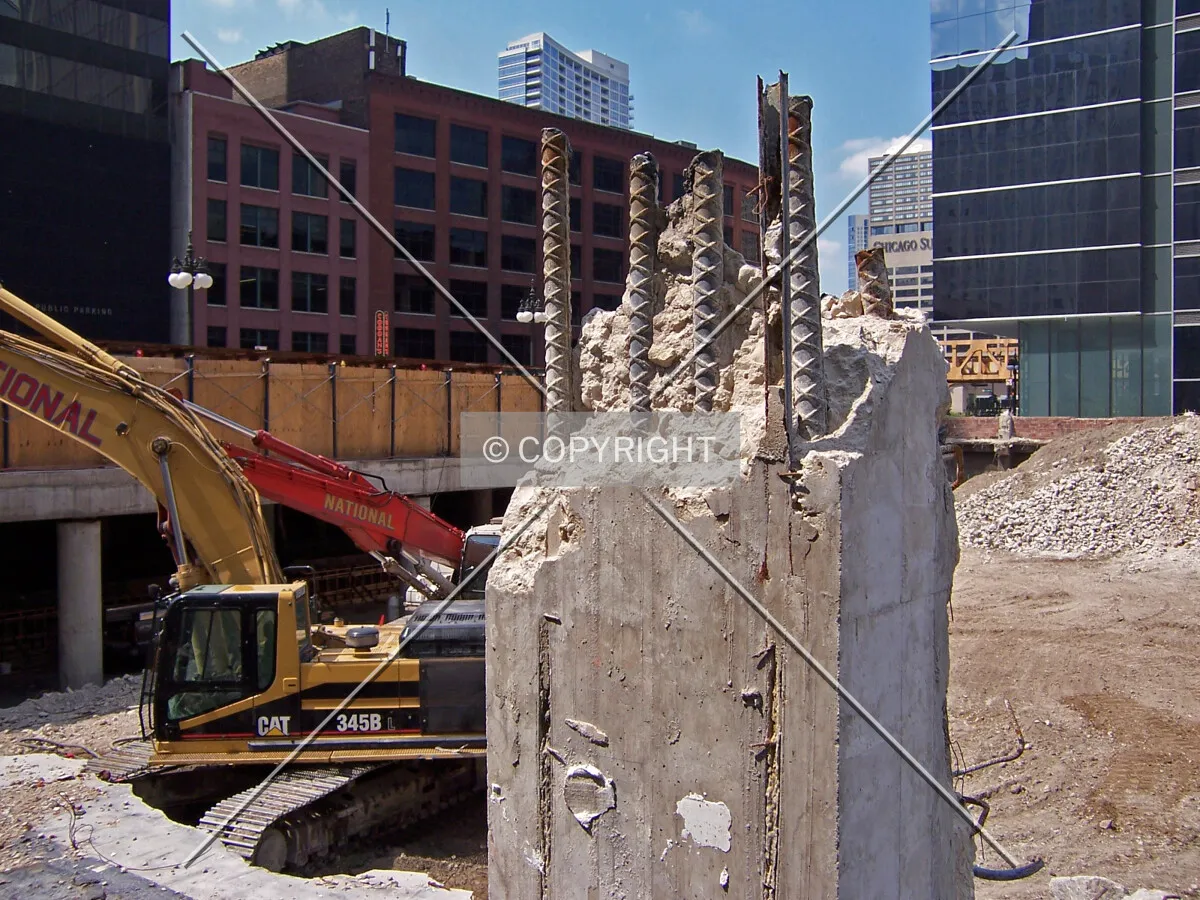 Looking northwest across the site from Randolph Street at a column from the former 10-story building at 155 North Wacker