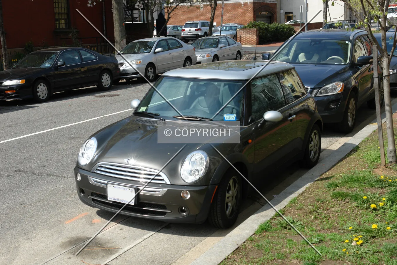 A dark gray Mini car
