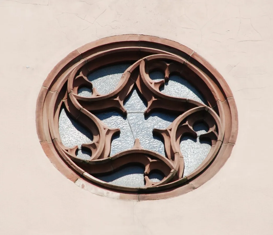 Small round window high above the main entrance