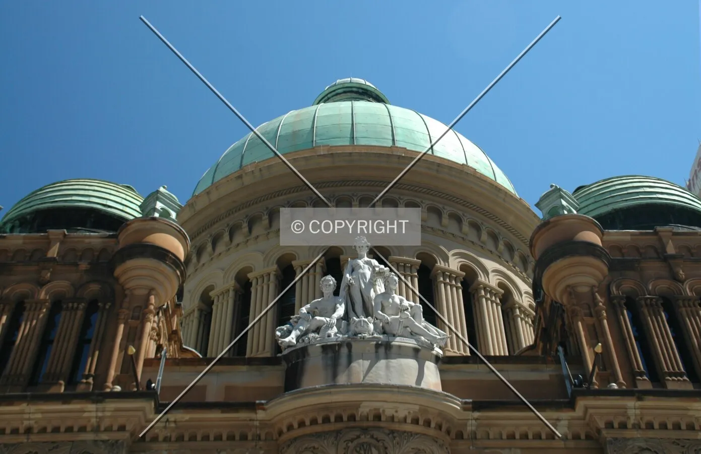 Looking up at the statue and central domes from George Street