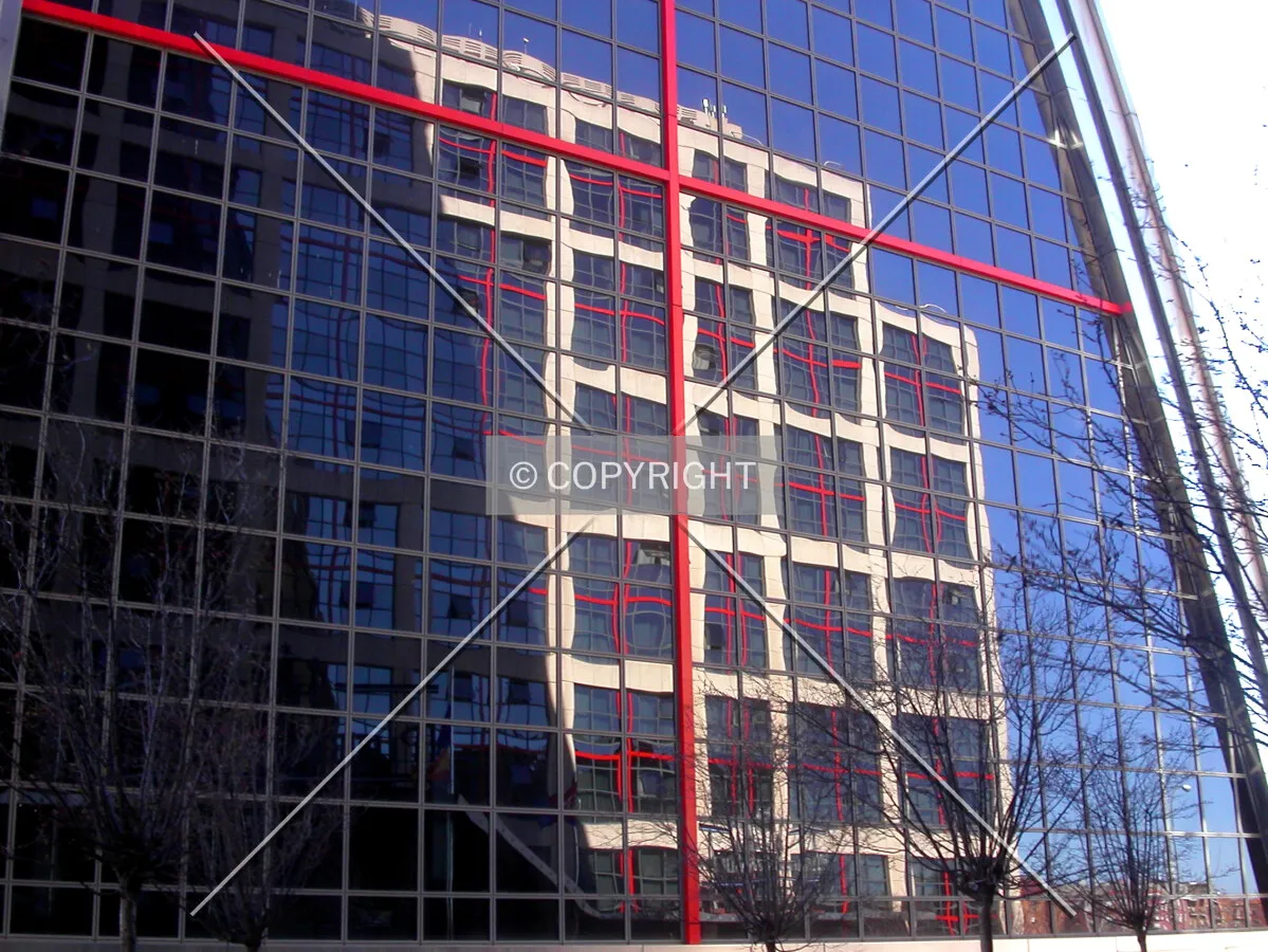 Reflection on the facade from a nearby building
