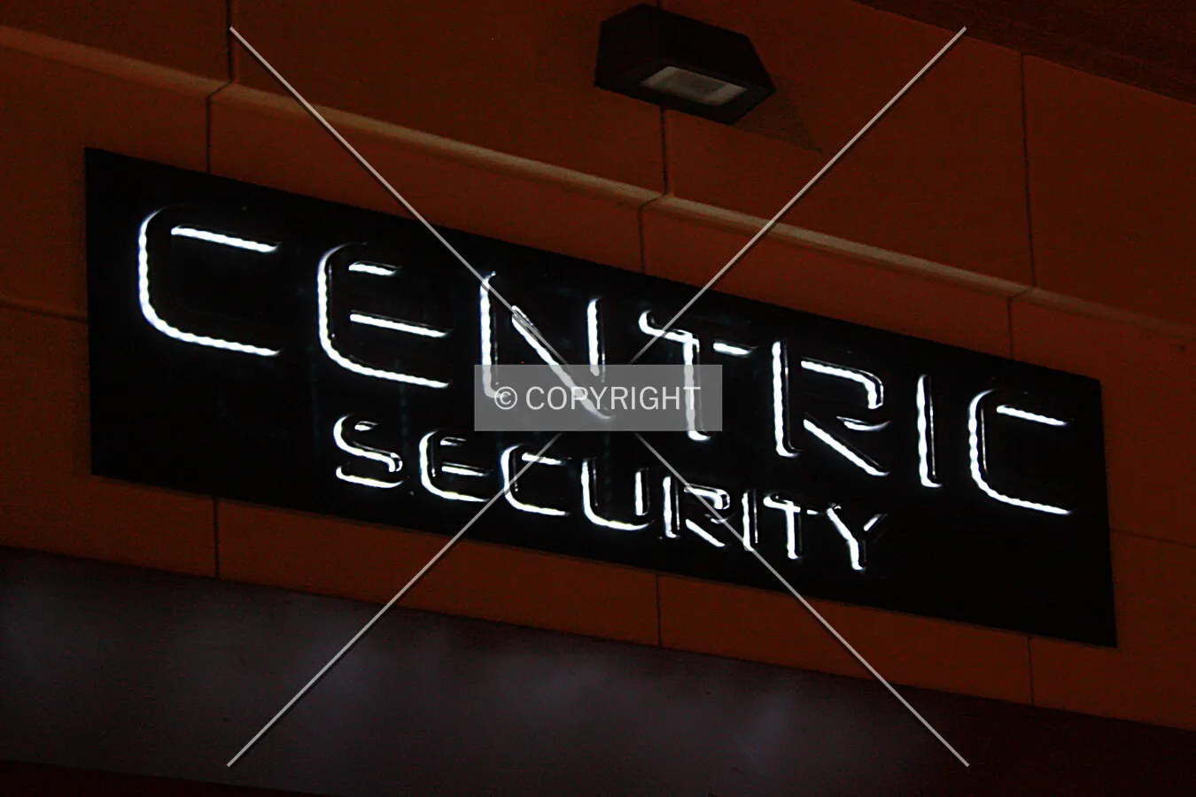Centric Security sign on the north facade at night; December 23, 2014