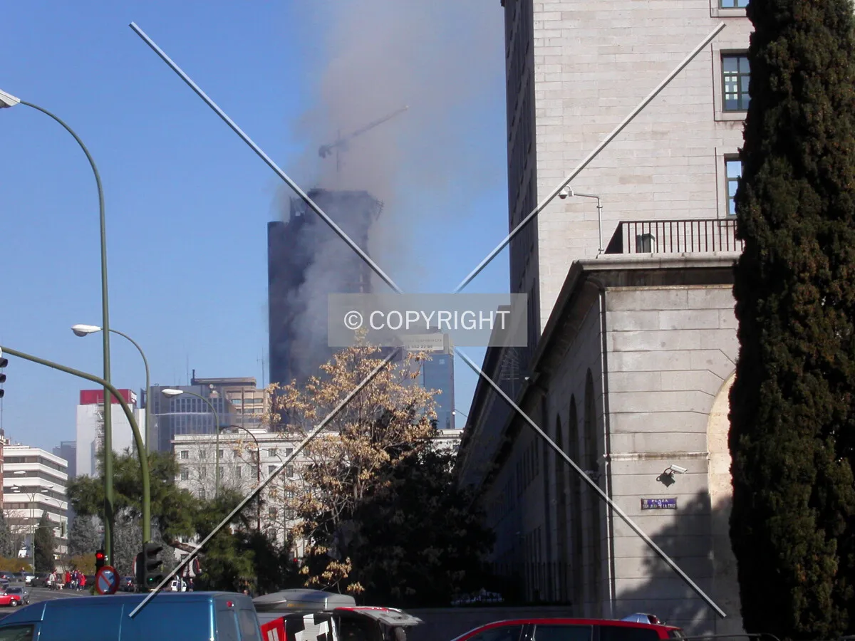 The building on fire as seen from the south