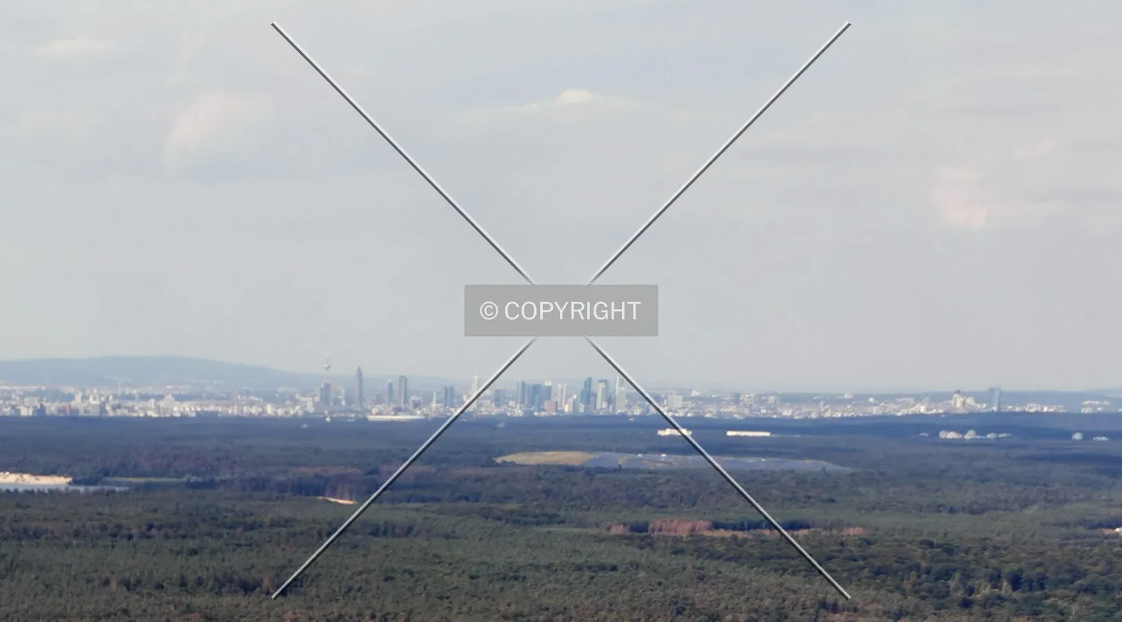 Flight with a helicopter from Egelsbach to Frankfurt - the skyline of Frankfurt in the far distance
