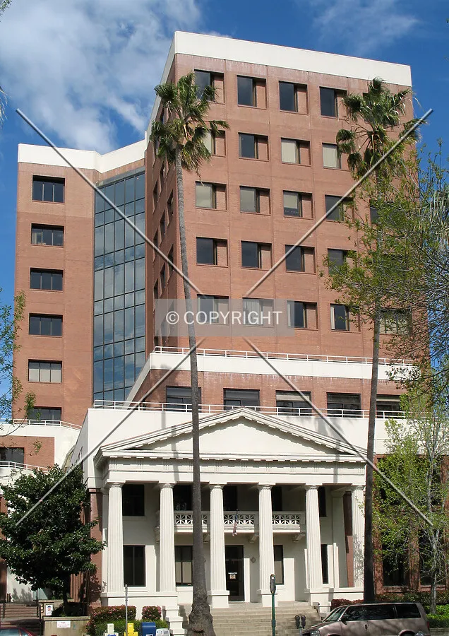 West side and main entrance along North 3rd Street includes the classic entrance of the original building with the newer tower rising behind