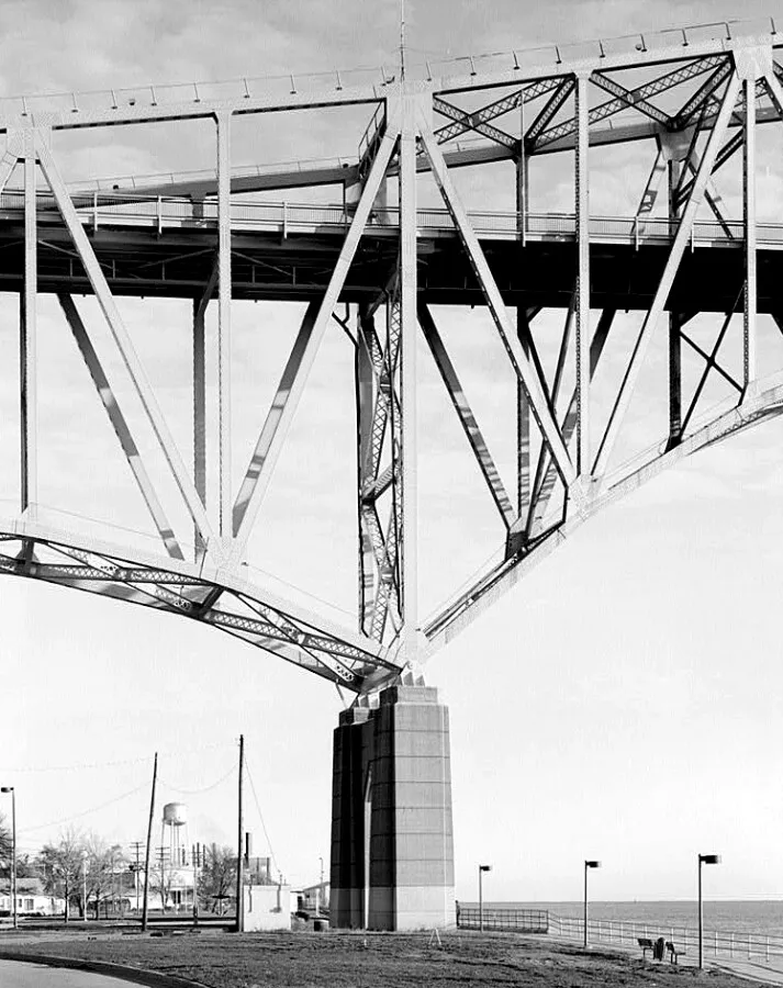 Vintage view from the southwest of the cantilever, anchor arms, and pier at the main span