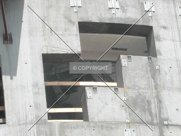 View of the works inside the building through one of the windows