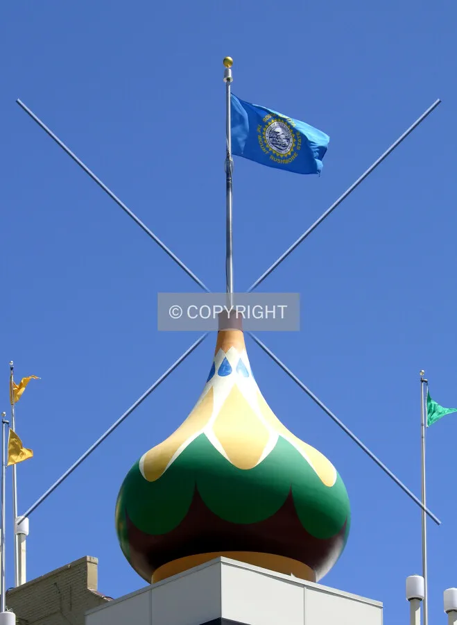 South Dakota flag atop the southwest corner