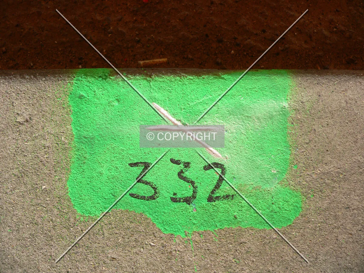 Settlement mark on the curb of lower Lake Shore Drive