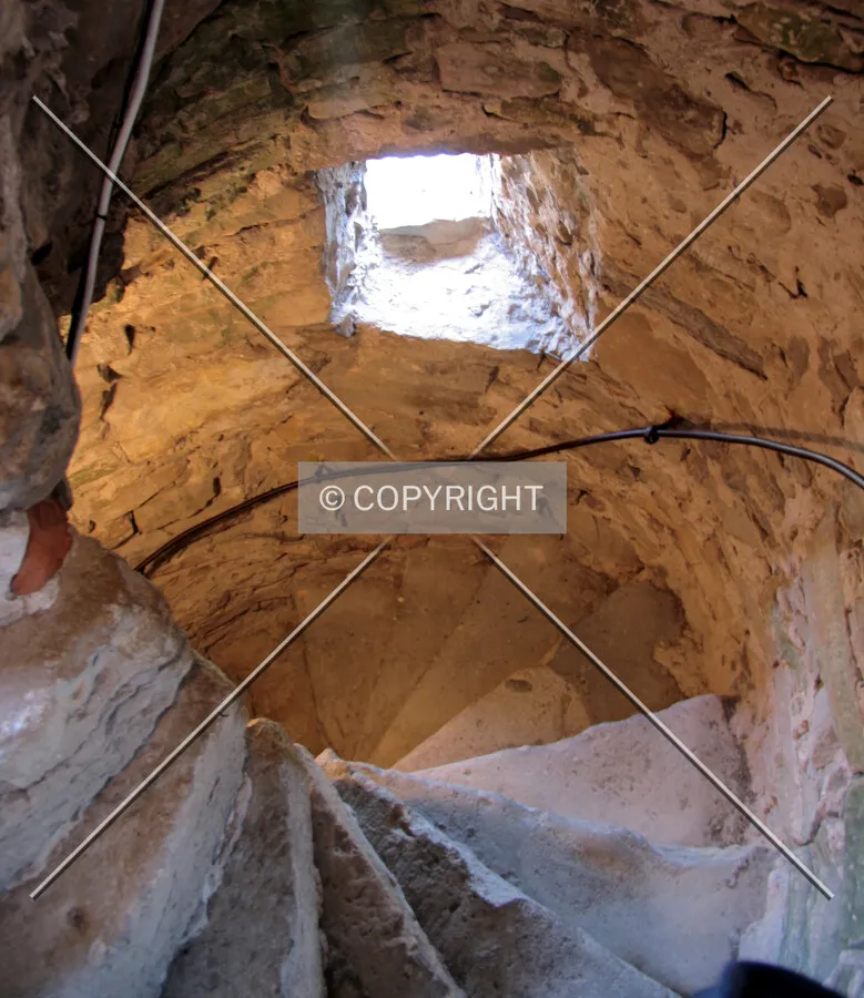 Looking down the clock tower's spiral stairs