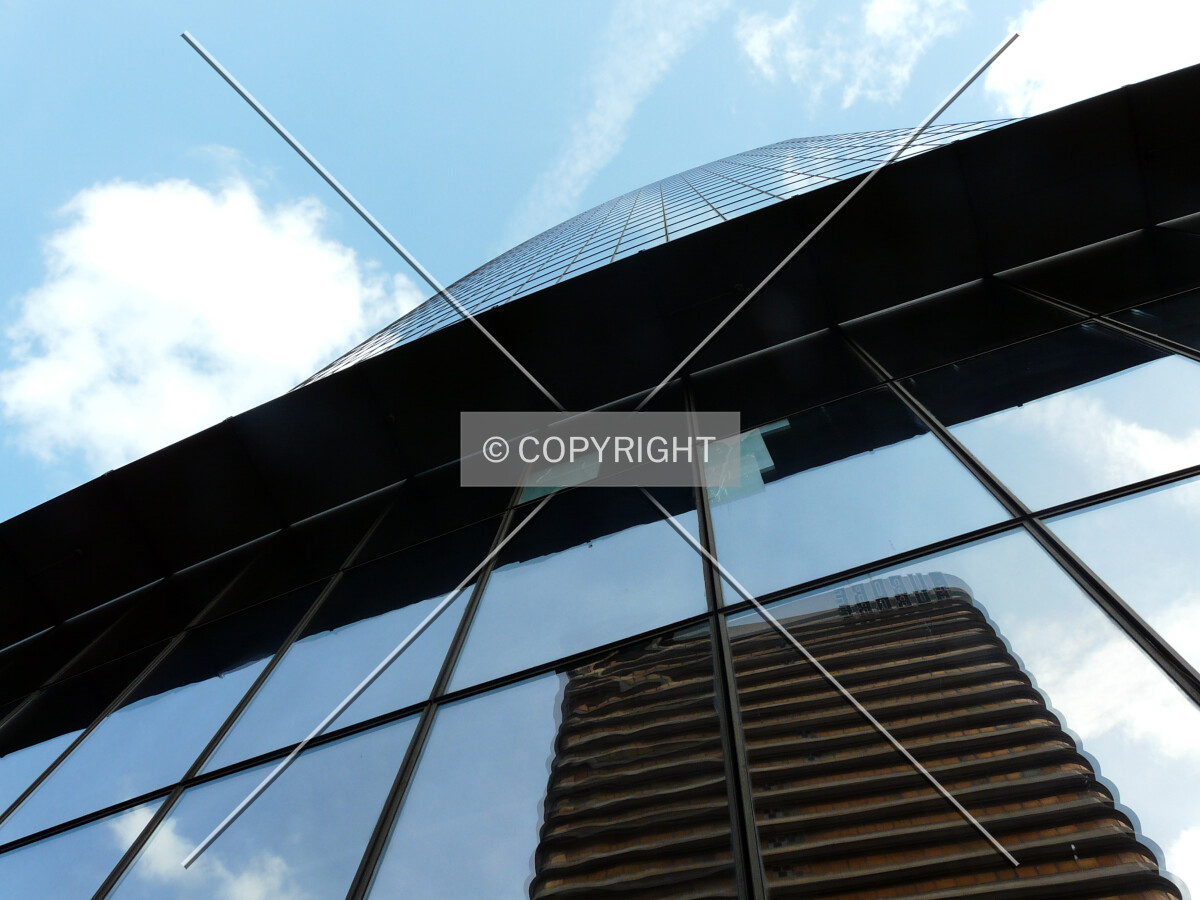 Tour Aurore reflecting in the northwest facade