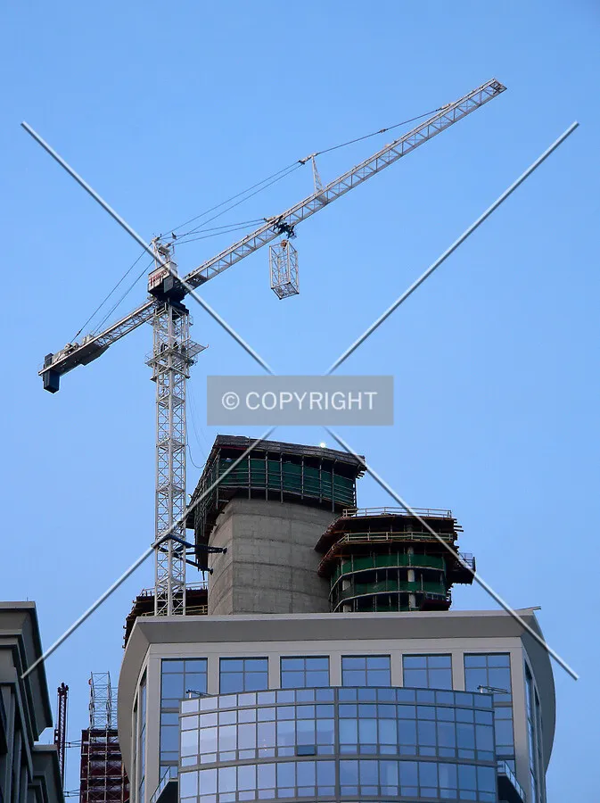View from the south as additional sections of tower crane are added as seen above Museum Tower