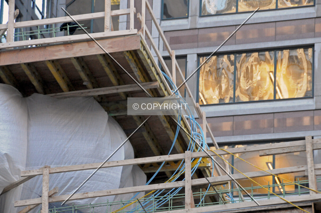 Post-tensioning cables hanging from a temporary decking in the parking garage