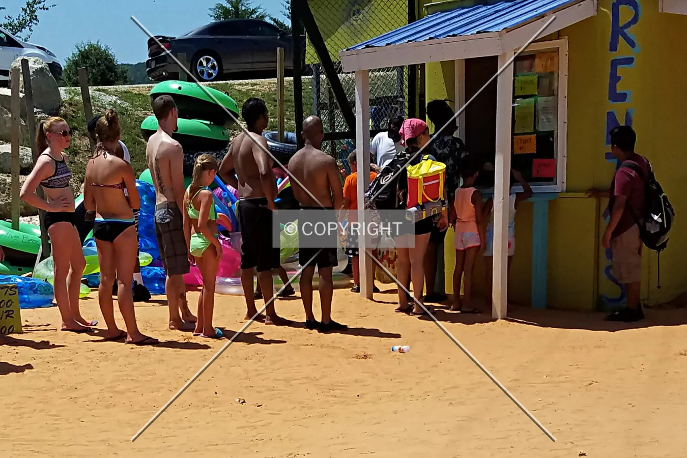 People waiting in line for life jackets; July 22, 2017
