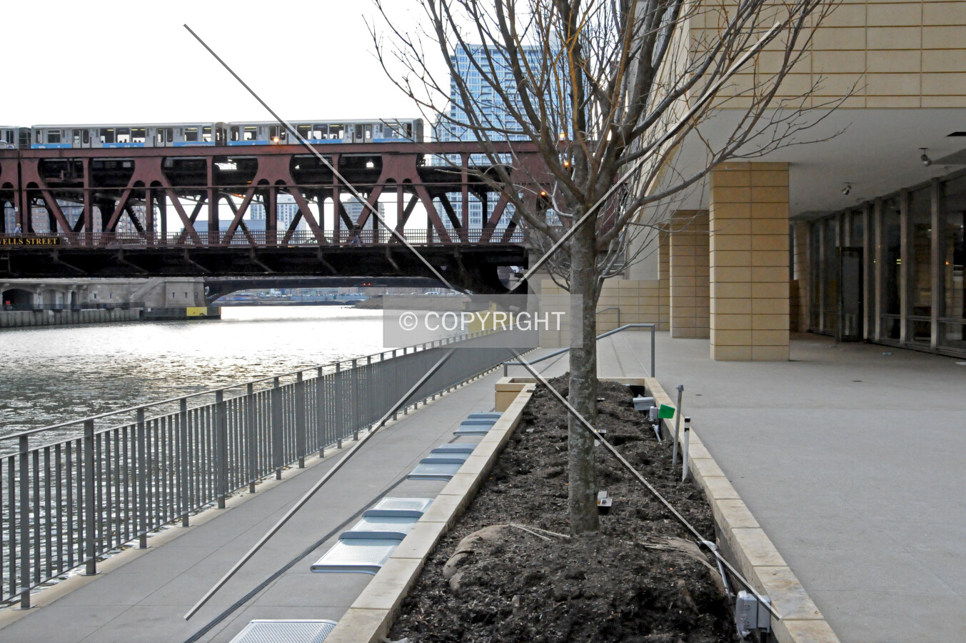 Planter boxes on the lower level of the river walk