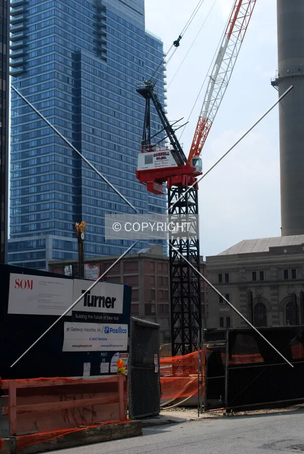 Construction fence and crane
