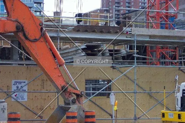 The scaffolding covering the sidewalk