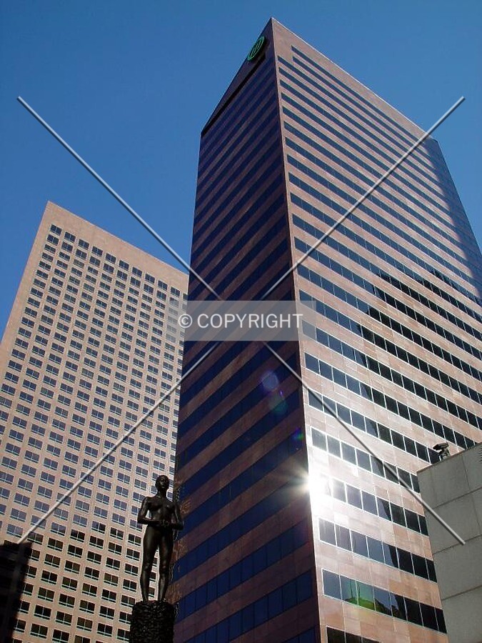Mellon Center with KPMG Tower as backdrop in the glare of a low December sun