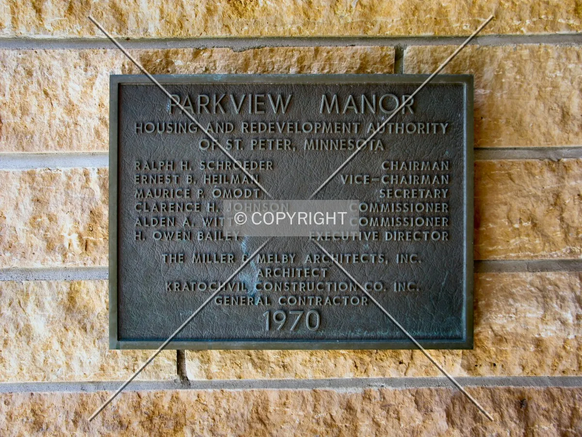 Dedication plaque at main entrance, with locally-quarried Kasota limestone
