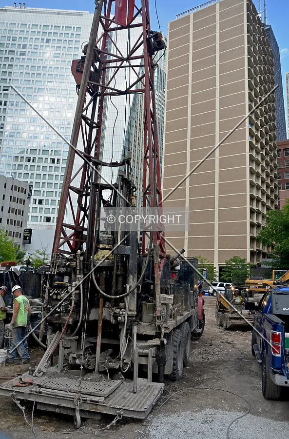 Pre-construction soil test borings drilled through the ruble of recently demolished buildings along State Street, looking east. June 27, 2013.