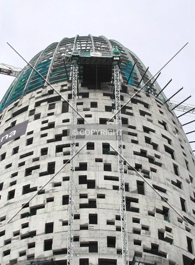 View of one of the facade elevators to the top of the building