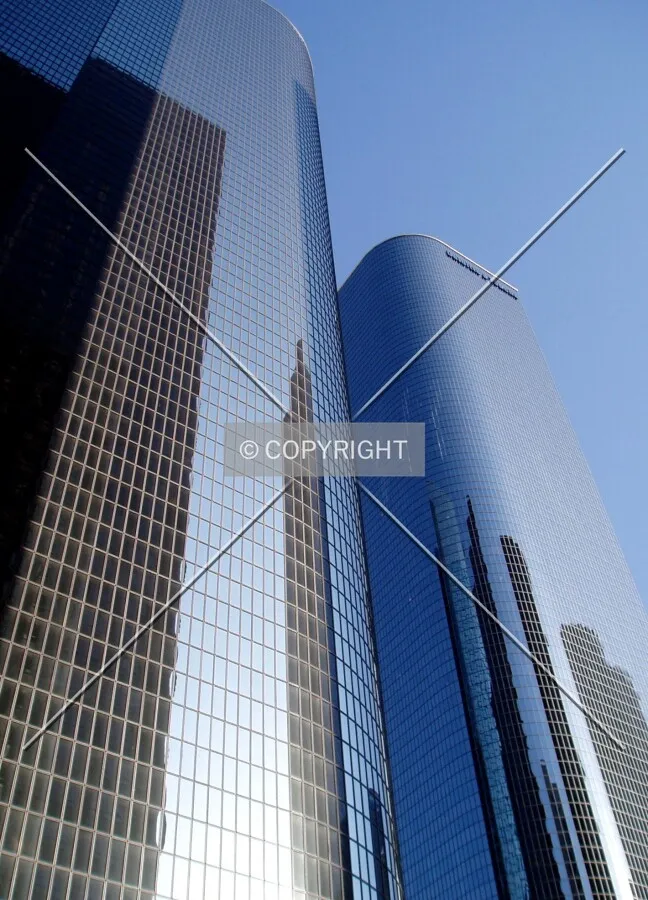 The towers' sloping edges create a smooth visual transition between them