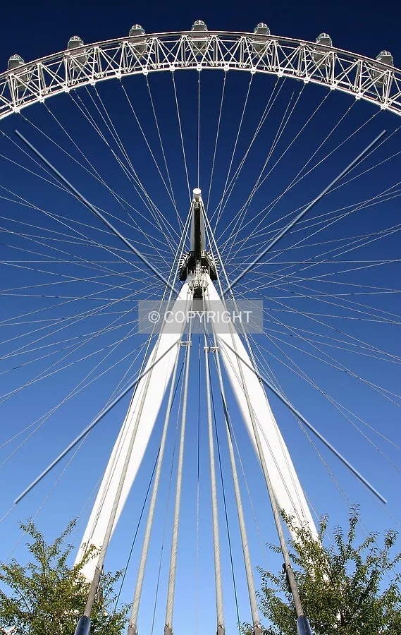View west looking up at the A-frame, spokes and top of the rim