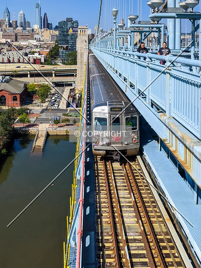 New Jersey-bound PATCO train on the lower deck with the Philadelphia skyline at rear
