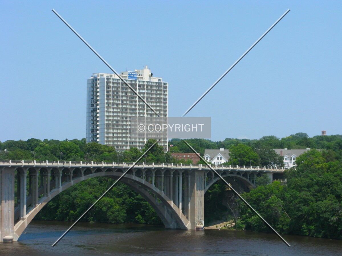 View to the northeast from Minnehaha Park in Minneapolis, rising beyond the Intercity Bridge over the Mississippi River