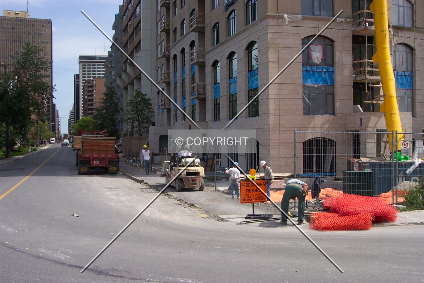 The protective wooden fence and scaffolding has been removed from the sidewalk, opening-up the site to onlookers