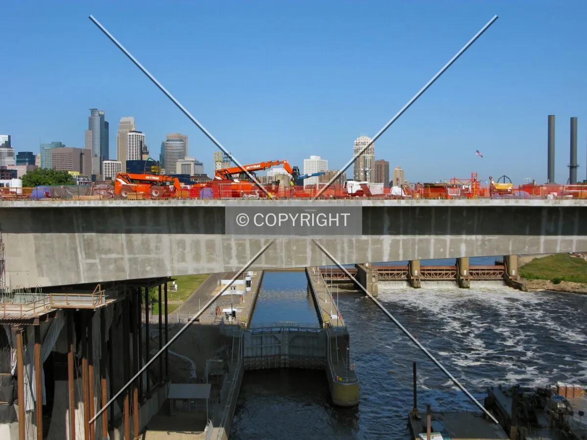Long center span rising north over the Lower St. Anthony Locks