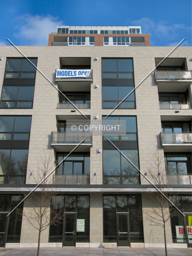 Tower rising above the low-rise section from Main Street SE