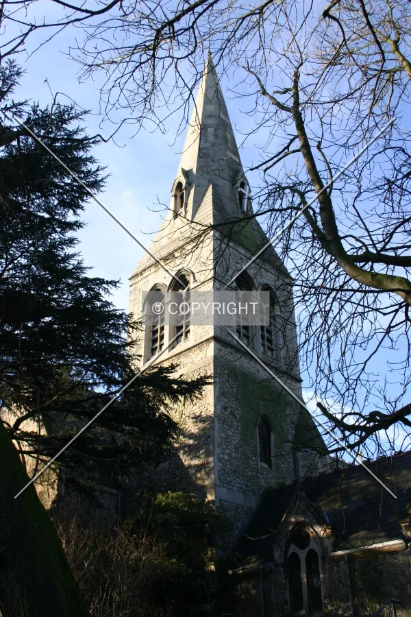 Looking up at the spire from Crouch End Hill