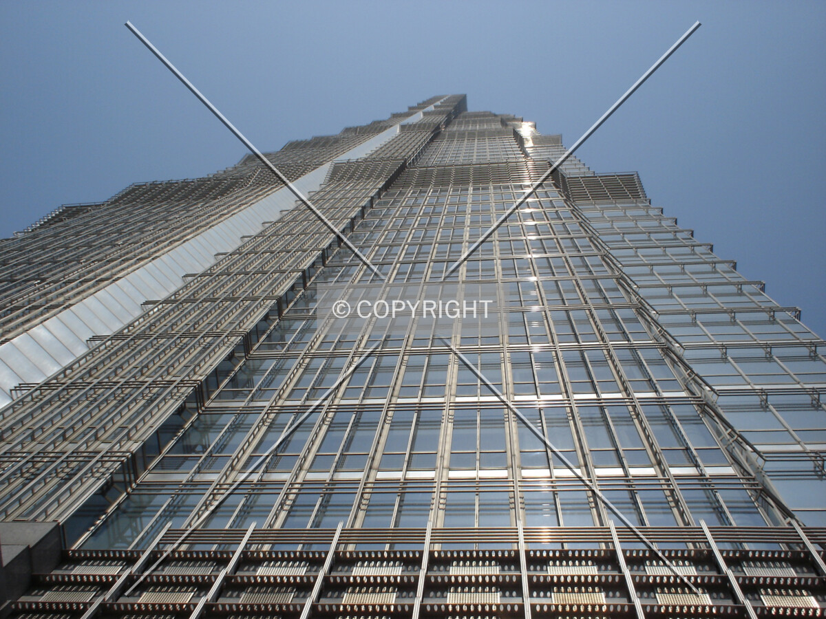 Looking up to the top of Jin Mao Tower