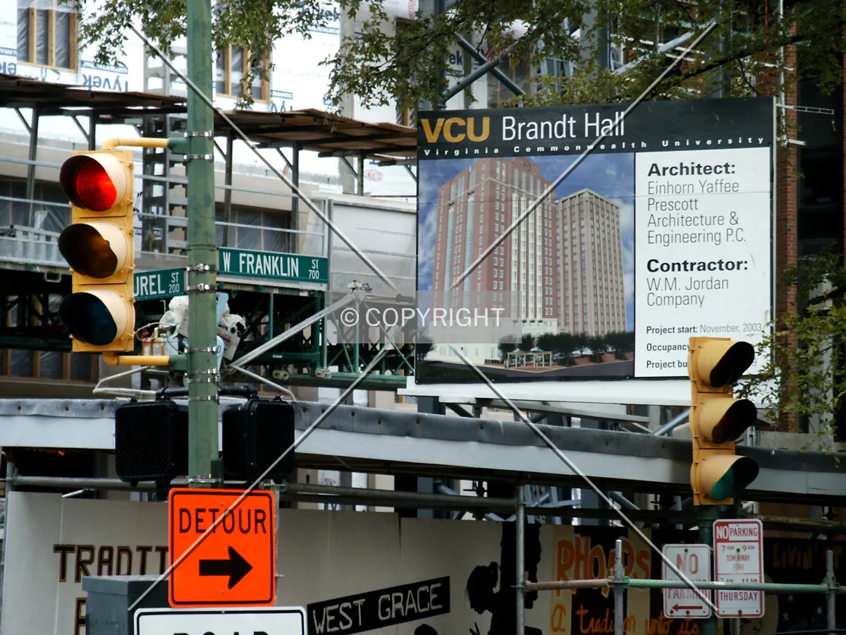 Signs around the base at the southwest corner