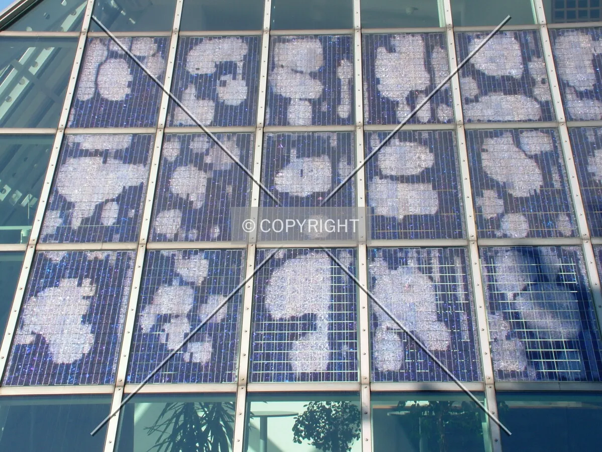 Photovoltaic pannels clad south side of the glass base